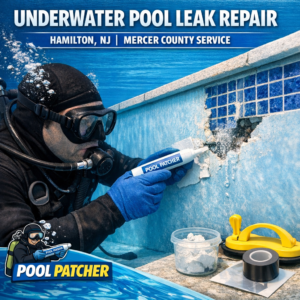 Technician in scuba gear repairing an underwater pool leak in Hamilton, NJ.