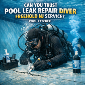 Professional diver repairing an underwater pool leak in New Jersey using patching equipment.