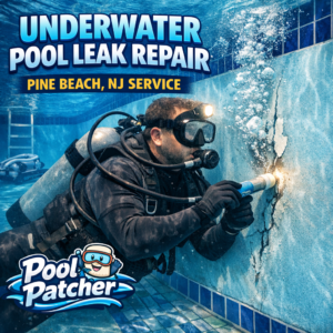 Technician repairing an underwater pool leak using specialized tools in Pine Beach, NJ.